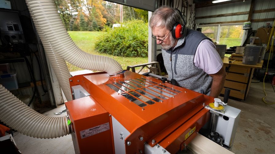 Ken runs boards through his Wood-Mizer moulder/planer