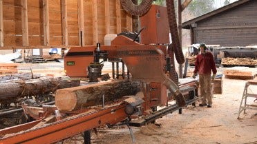 Harrop-Procter Community Co-op LT70 sawmill cutting
