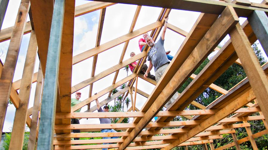 Wood-Mizer Employees Raising Cabin Frame