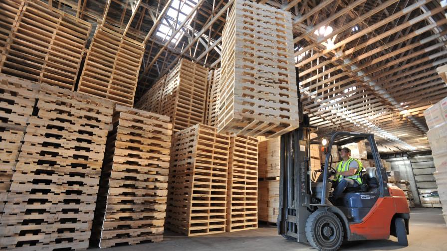 Production facility with stacked wood pallets